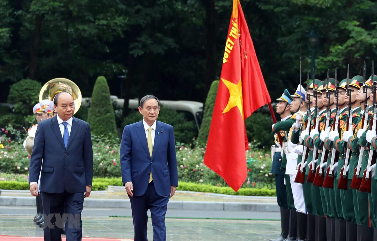 Truyền thông Nhật đưa đậm nét chuyến thăm Việt Nam của Thủ tướng Suga - Ảnh 1.