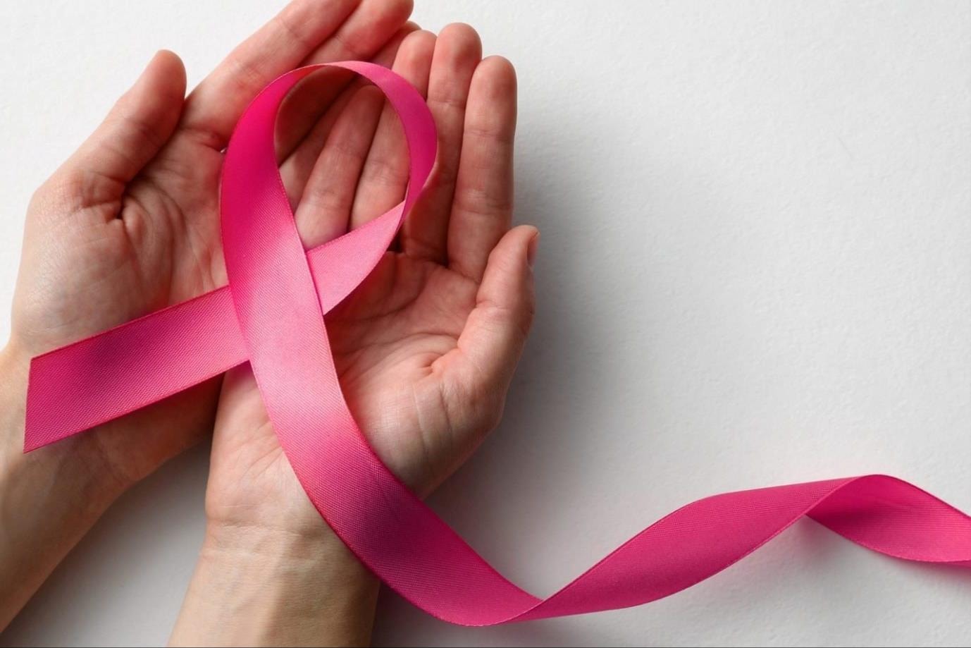 breast-cancer-ribbon-hands-e1696511618263(1).jpeg